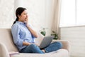 Tired asian lady freelancer working from home, using laptop Royalty Free Stock Photo