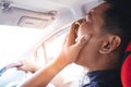 Tired asian man driving his car Royalty Free Stock Photo