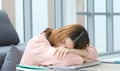 Tired asian woman sleeping at home office desk, Work from home, Sleepy asia girl university student take a break from online study Royalty Free Stock Photo