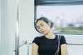 Tired Asian woman sleeping in train Royalty Free Stock Photo