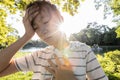 Tired asian woman suffer from sunburn very hot in summer weather problem feel faint,dizzy,difficulty breathing,female teenage with Royalty Free Stock Photo