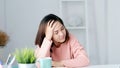 Tired asian woman take a nap at home office, Overworked asia female take a break from stress work, Exhausted office girl asleep at Royalty Free Stock Photo