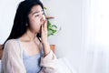 Tired Asian woman yawning  after wake up in bed feeling sleepy in the morning , sleepless or insomnia concept Royalty Free Stock Photo