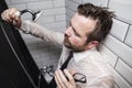 A tired bearded man in a business shirt and tie closed his eyes Royalty Free Stock Photo