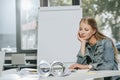 tired beautiful businesswoman resting chin on hand at table Royalty Free Stock Photo