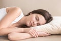 Tired beautiful lady resting on sofa at home Royalty Free Stock Photo