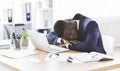 Tired black businessman sleeping in his office Royalty Free Stock Photo