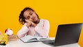 Tired black girl sitting at desk and sleeping Royalty Free Stock Photo