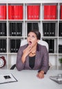 Tired bored business woman yawning. Overwork concept Royalty Free Stock Photo