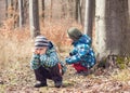 Tired or bored child in forest