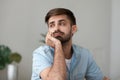 Tired bored man looking in distance, feeling lazy, lack motivation Royalty Free Stock Photo