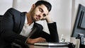 Tired bored young businessman in office Royalty Free Stock Photo