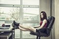 Tired bored young female office worker Royalty Free Stock Photo