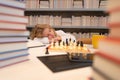 Tired and boring school. Early development. The concept of learning and growing children. Chess, success and winning. Royalty Free Stock Photo