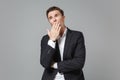 Tired boring young business man in classic black suit shirt posing isolated on grey wall background. Achievement career Royalty Free Stock Photo