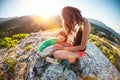 The tired boy lies on his mother`s feet. Royalty Free Stock Photo