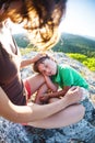 The tired boy lies on his mother`s feet. Royalty Free Stock Photo