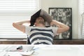 Tired business man sleeping atc his desk overing his head with a laptopin his office Royalty Free Stock Photo