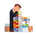 Tired business man sleeping on stacked paper pile