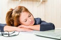 Tired business woman asleep at his desk Royalty Free Stock Photo