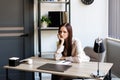 Tired business woman sitting at her working place. Overwork, working overtime and stress at work concept Royalty Free Stock Photo