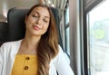 Tired business woman sleeping sitting in the train after a day of work . Train passenger traveling sitting relaxed and sleeping Royalty Free Stock Photo
