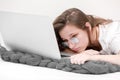 Tired business woman working at home, headache and falling asleep at work. Home work. Learns, using laptop computer on table. Royalty Free Stock Photo