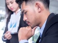 Tired businessman at desk with laptop searching way out from difficult situation. Thoughtful stressed frustrated man working for Royalty Free Stock Photo