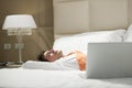 Tired Businessman Lying on Bed Royalty Free Stock Photo