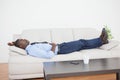 Tired businessman lying on the sofa Royalty Free Stock Photo