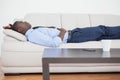 Tired businessman lying on the sofa Royalty Free Stock Photo