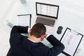 Tired businessman sleeping while calculating expenses in office