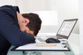 Tired Businessman Sleeping While Calculating Expenses In Office Royalty Free Stock Photo