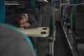 Tired Businessman Sleeping on Coach Bus Table Royalty Free Stock Photo