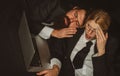 Tired businessman sleeping in dark office, young business woman overworked at office. Portrait of stressful tired young Royalty Free Stock Photo