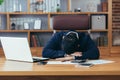 Tired businessman sleeping on the desk, man lying down and resting Royalty Free Stock Photo