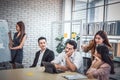 Tired businessman sleeping in a meeting conference in office ,  business team people looking sternly at snoring at meeting Royalty Free Stock Photo