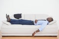 Tired businessman sleeping on the sofa Royalty Free Stock Photo