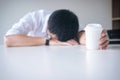 Tired businessman sleeping at work in modern office with hand ho Royalty Free Stock Photo