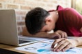 Tired businessman sleeping at work in modern office with hand ho Royalty Free Stock Photo