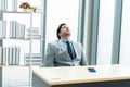 Tired businessman sleeping at work in the office Royalty Free Stock Photo