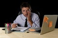 Tired businessman suffering work stress wasted worried busy in office late at night with laptop computer Royalty Free Stock Photo