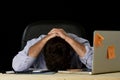 Tired businessman suffering work stress wasted worried busy in office late at night with laptop computer Royalty Free Stock Photo