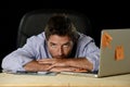 Tired businessman suffering work stress wasted worried busy in office late at night with laptop computer Royalty Free Stock Photo