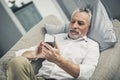 Tired exhausted businessman lying on sofa Royalty Free Stock Photo