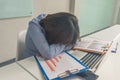 Tired businesswoman accountant sleeping in business office