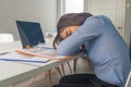 Tired businesswoman accountant sleeping with report and paper folders in office