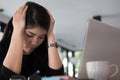 tired businesswoman with hand on head at office. frustrated young woman with headache at workplace. exhausted startup in Royalty Free Stock Photo