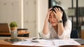 Tired businesswoman holding her head , thinking of problem solution. Emotional pressure, stress at work concept Royalty Free Stock Photo