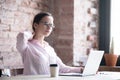 Tired businesswoman massaging strained neck muscles at workplace Royalty Free Stock Photo